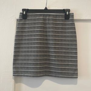 Black and white striped skirt with elastic waistband.